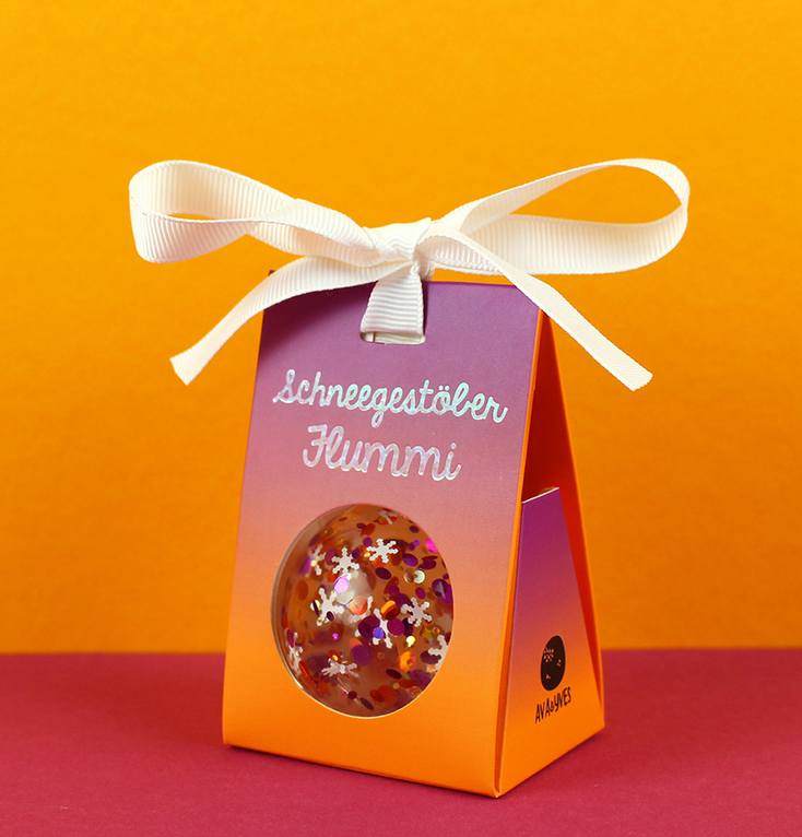 Schneegestöber Flummi mit Konfetti, Schneeflocken, Lila/kupfer/weiss, 49mm, in einer Geschenkverpackung